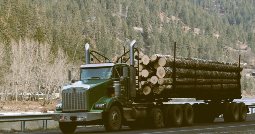 Logging truck hauling logs on Highway 12 near Orofino Idaho — Goicoechea Law workers compensation attorney